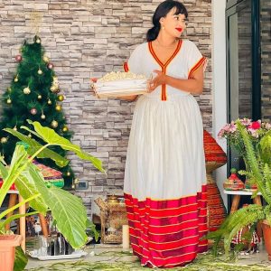 Regal radiance menen fabric habesha dress with golden cross details habesha kemis