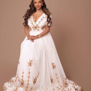 Breathtaking Golden Traditional Ethiopian Dress: Adorned with Handmade Cross Design Habesha Dress Gorgeous Ethiopian Wedding Dress